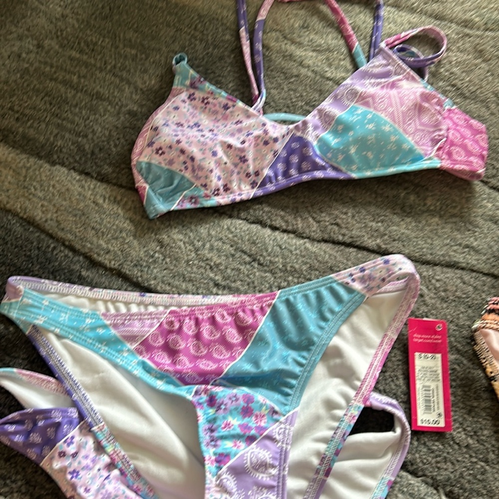 Two-piece Xhilaration bikini.  Two bottoms included, one with tags attached.